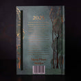 Cargar la imagen en la vista de la galería, back of the 13 moon journal 2025 with green trees gold text and outlines