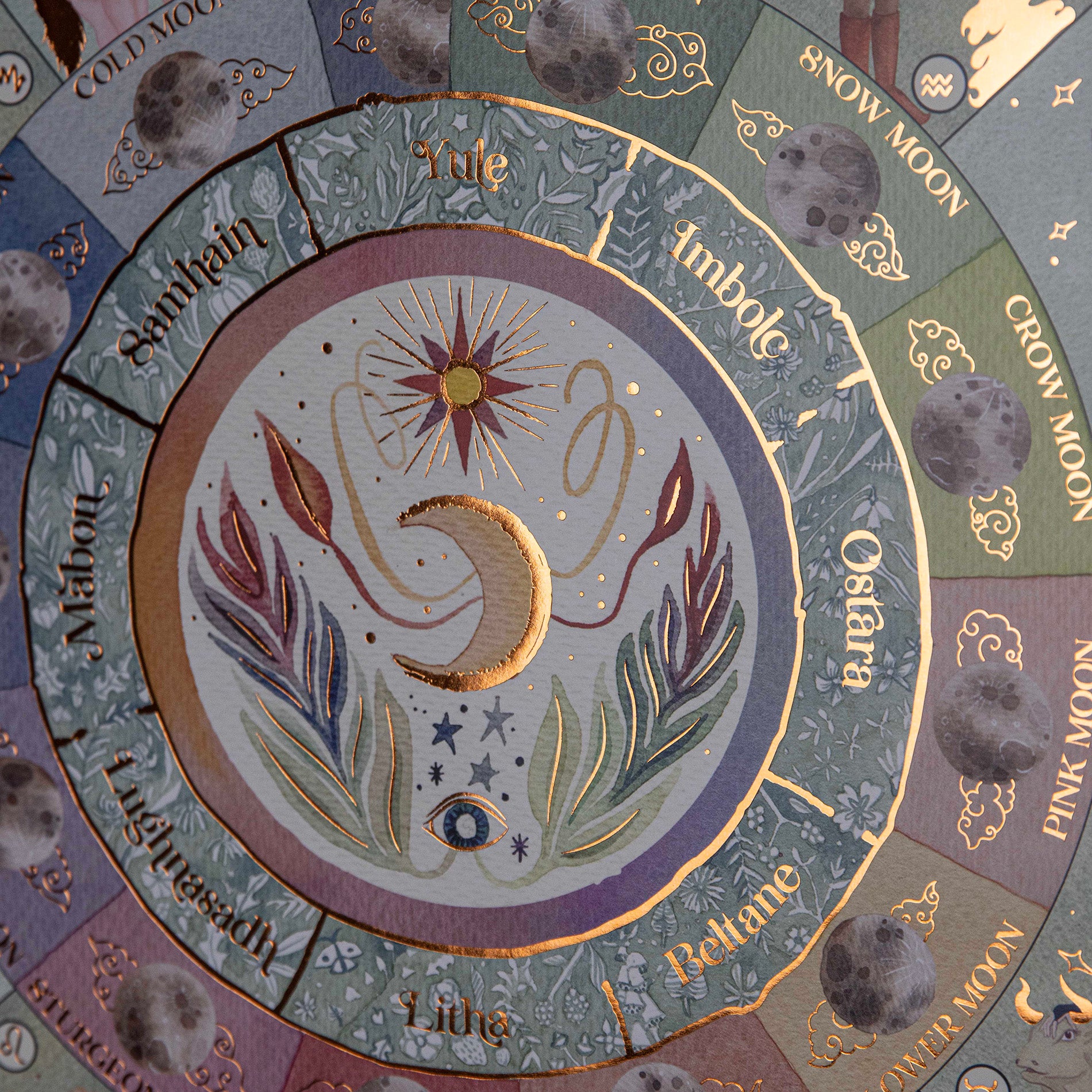 showing the center of the moon phase calendar 2025 with lots of details with gold leaf details